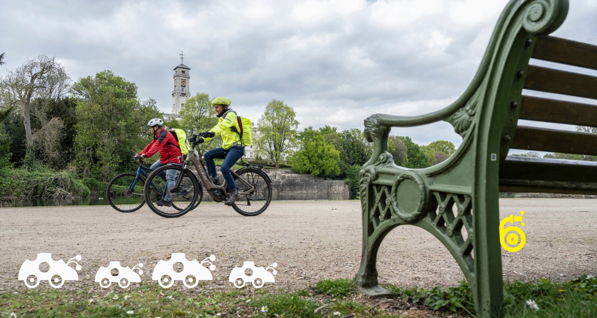 Two men cycle along a pathway in a park on a cloudy day. They're wrapped up safely in fluorescent jackets and helmets. White cartoon ladybirds make their way along the bottom left of the image, whilst a yellow cartoon snail slithers up the leg of a green bench in the bottom right foreground.